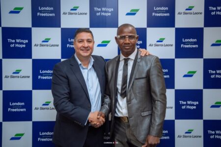 Group Chief Operating Officer, XE Jet Limited, Mr Sukhjinder Mann, technical partners to Air Sierra Leone, pictured with Mr. Usman Touray, the first passenger on board the airline’s Freetown-UK flight in September 2025.