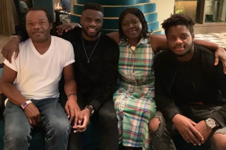 Frances Tiafoe with his parents and twin brother Franklin