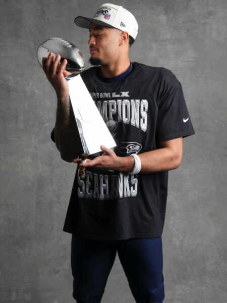 Jaxon Smith-Njiba with the NFL trophy