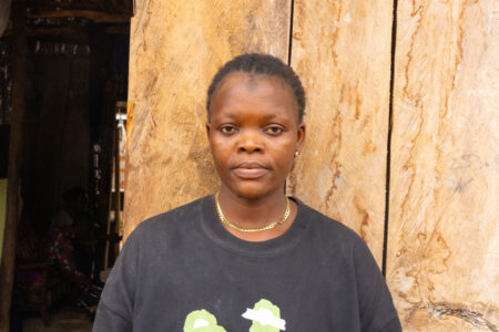 Jariatu Sannoh stands at the entrance of her workshop