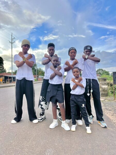 Pellet Aiah Foday (far right) & Members of Tabitha Talent Academy posing in the street of Kono District