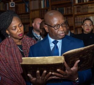 President Bio and First Lady Fatima Bio view the Mende Bible in Quincy, Massachusetts.