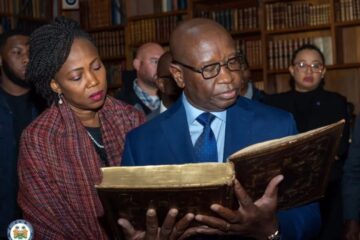 President Bio and First Lady Fatima Bio view the Mende Bible in Quincy, Massachusetts.