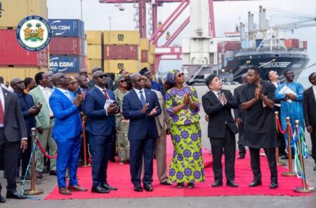 The President alongside key stakeholders pose as the ship moves