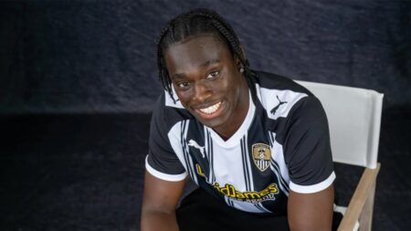 Hindolo Mustapha smiling after agreeing a loan move to Notts County