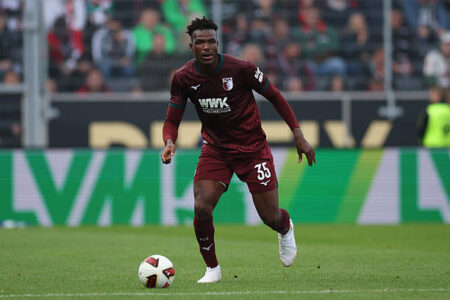 Juma Bah playing for FC Augsburg in a Bundesliga match