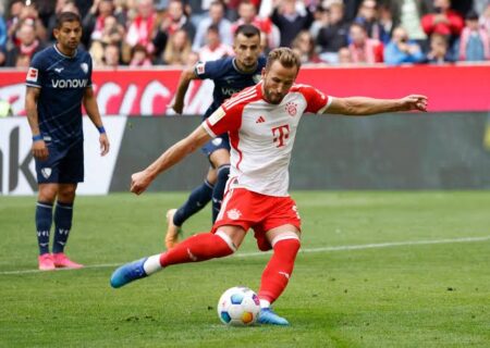 Harry Kane (front) taking a penalty